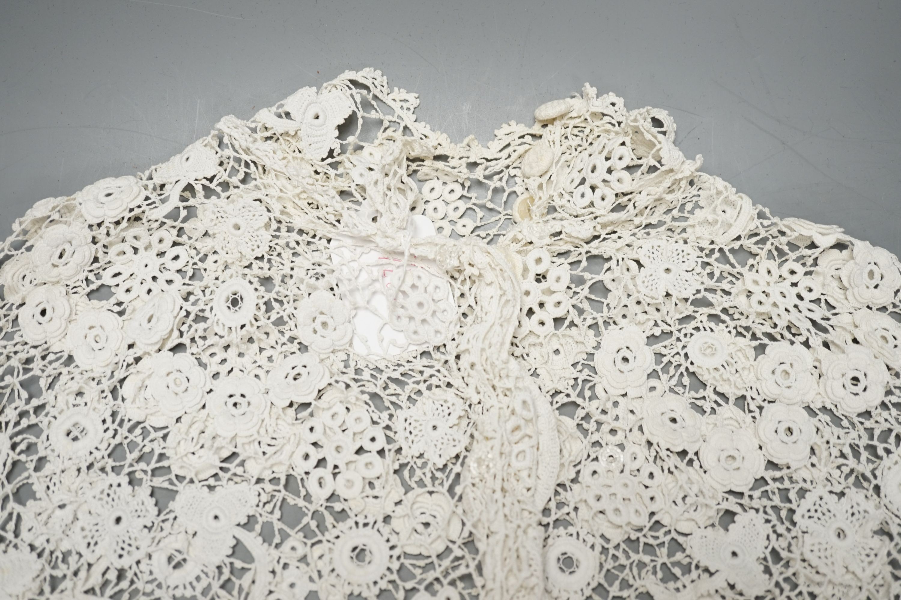 A 19th century hand made Irish crochet jacket, with long sleeves and high collar, a bobbin lace and white worked patch worked blouse, a fine lawn and anglaise worked blouse and a fine bobbin lace trimmed and white worked